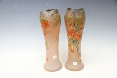 two vases that have been painted with flowers on them