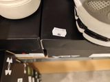 a pair of shoes that are sitting on a shelf