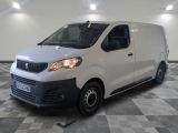the white van is parked in a large room with a checkered floor