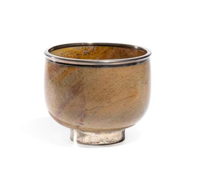 a small brown bowl with a silver rim on a white surface