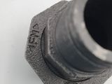 a close up of a metal pipe on a white surface