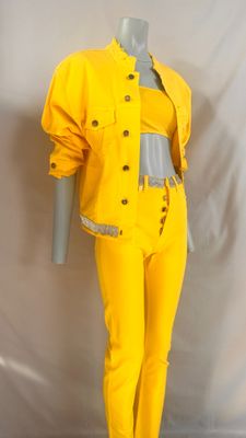 a mannequin wearing a yellow jacket and pants on a mannequin mannequin