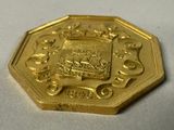 an image of a gold coin with a coat of arms on it