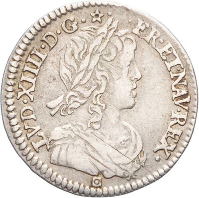 une pièce d'argent portant une tête de femme et une couronne