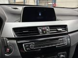 a car dashboard with a car radio and a steering wheel
