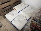 three mattresses stacked on top of each other on a pallet