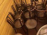 many chairs and a table in the corner of a room