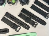 a lot of watches that are laying out on the table
