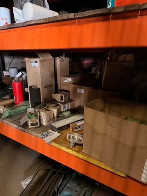 a shelf with boxes and boxes on it in a warehouse