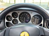 a steering wheel and dashboard of a car with various gauges