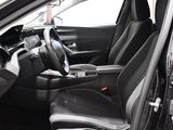 the interior of a car with black leather seats and a steering wheel