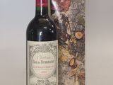 a bottle of wine sitting next to a box
