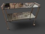 a glass table with a metal frame on it