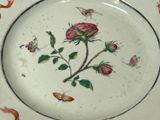 a white plate with a floral design on it
