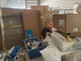 a pile of boxes and boxes on the floor in a room