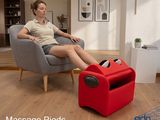 a woman that is sitting in a chair with a foot rest