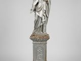 a statue of a woman holding a child on a pedestal