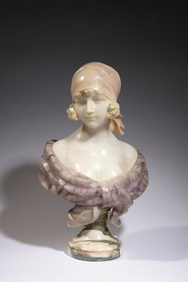 marble bust of a woman wearing a hat and a scarf