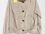 an image of a jacket hanging on a hanger on a wall