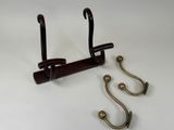 two hooks that are attached to a coat rack