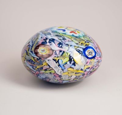 a decorative egg with a floral design on it