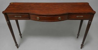 a small wooden table with two drawers and a drawer underneath it