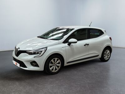 a white car parked in a white room with a black floor