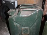 two green jerry cans sitting next to each other