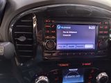 the dashboard of a car with a car radio in the center of it