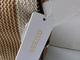 a bag with a tag on it sitting on a table