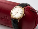 a watch that is sitting on top of a red case