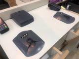 several cell phones are sitting on a white table with a phone on it
