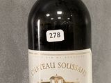 a bottle of wine that is sitting on a table
