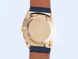 a close up of a watch with a blue strap
