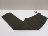 the bottom of a pair of olive green pants on a white surface