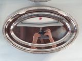 a person taking a picture of themselves in a mirror