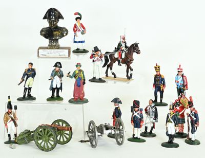 many figurines of soldiers on display on a white surface