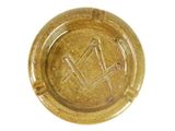 a gold ashtray with a masonic symbol on it