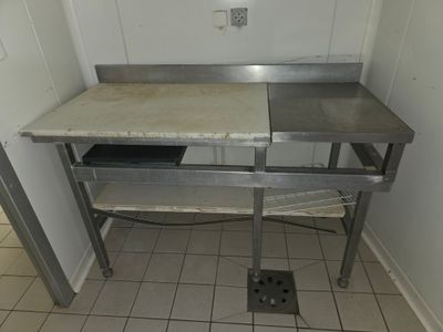 an image of a kitchen area with a sink and a counter