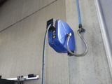 a blue bag hanging on the side of a building