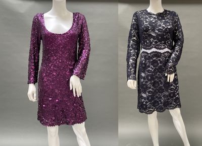 two mannequins dressed in purple and black dresses on display