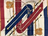 flag with musical instruments on it on a wooden surface