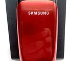 a red cell phone that is in a black box