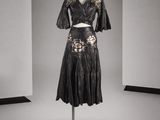 an image of a black dress on a mannequin stand