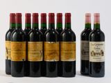 plusieurs bouteilles de vin sont alignées sur une surface blanche