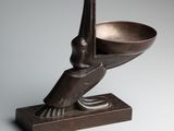 an image of a bronze bowl with a bird on it