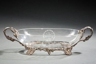 a glass bowl that has a handle on it