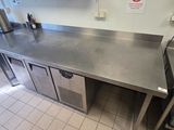 a large stainless steel counter in a commercial kitchen