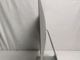 a laptop computer sitting on a stand on a white surface