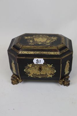 an image of a black and gold box with a number on it